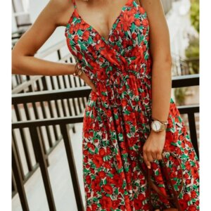 Woman wearing floral maxi dress in summer outdoor setting