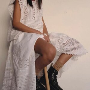 Boho white cotton maxi dress styled with summer hat and sandals